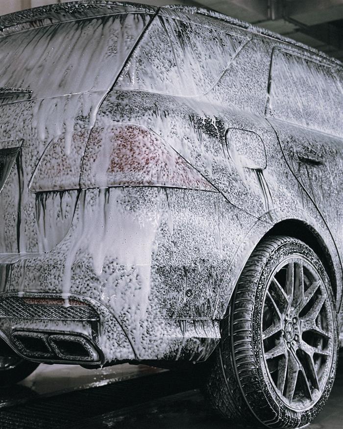 Snow foam lifting dirt from the paintwork before rinsing